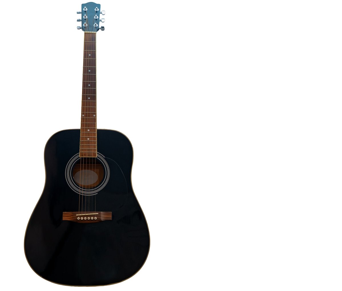 Black acoustic guitar standing vertically on a pure white background